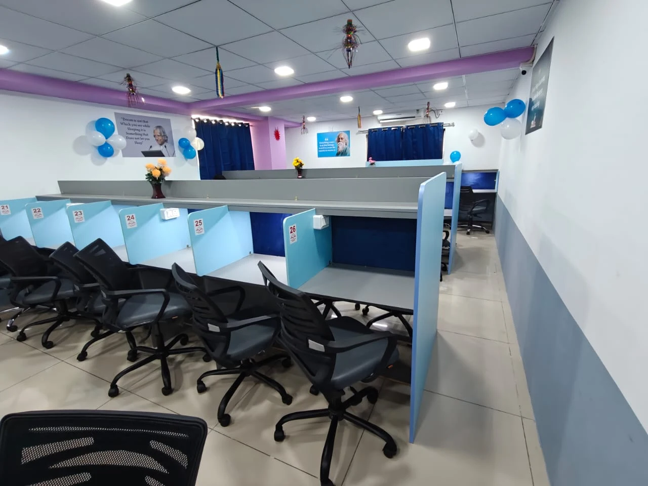 Long row of individual study desks along the wall